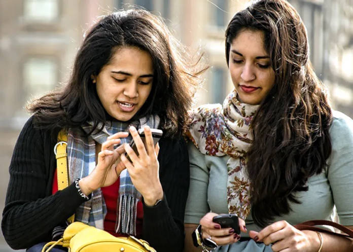 Girl using phone telecom