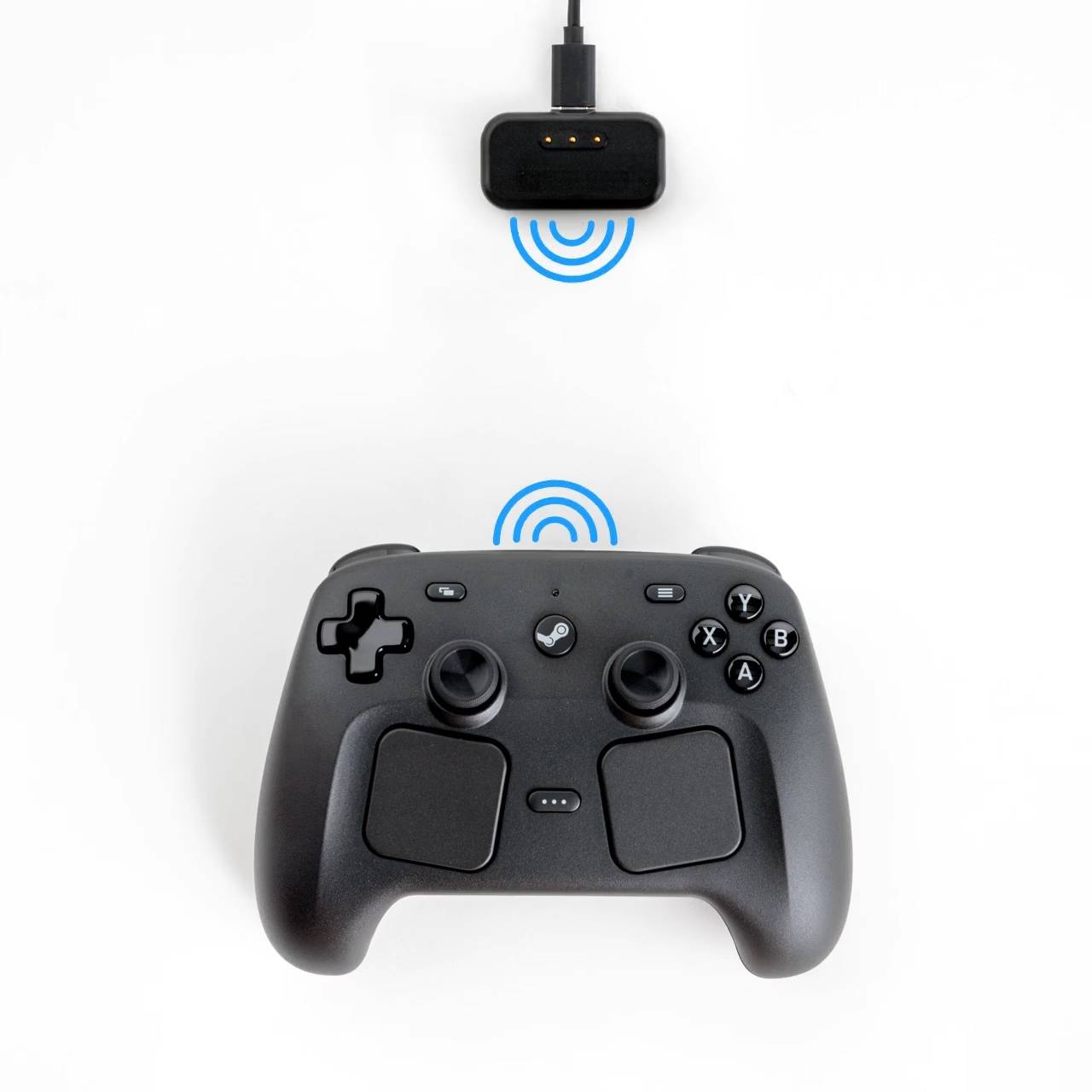 Steam Controller dapat terhubung dengan transmitter nirkabel bernama "Puck".